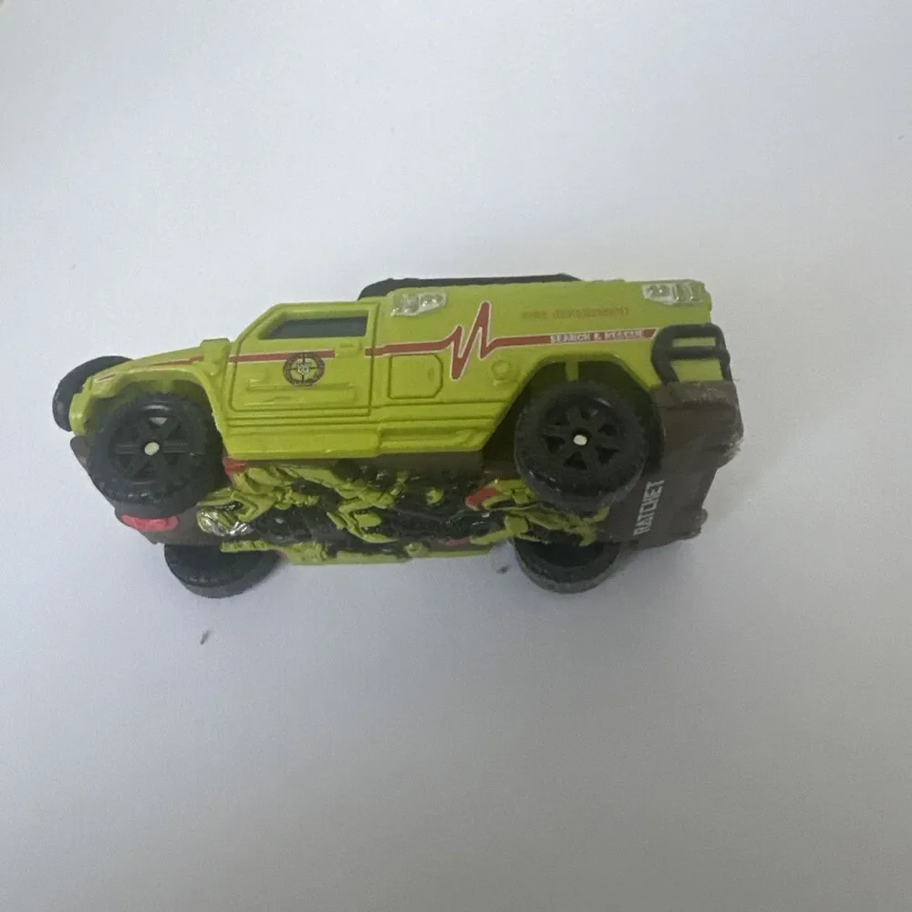 Hasbro TMCM Ratchet Search And Rescue Fire Department Green Vehicle